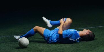 soccer player on the ground with an injury